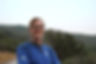 man-smiling-at-camera-in-forest